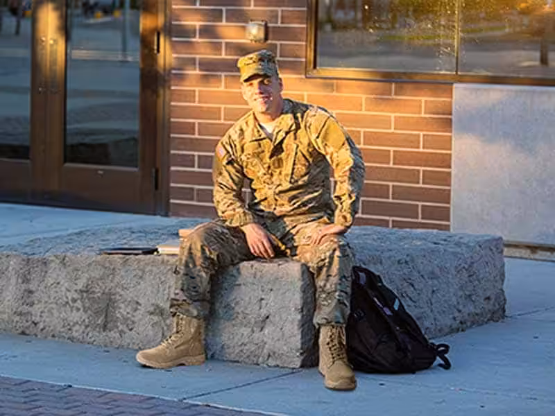 A soldier wearing tactical clothing and tactical boots.