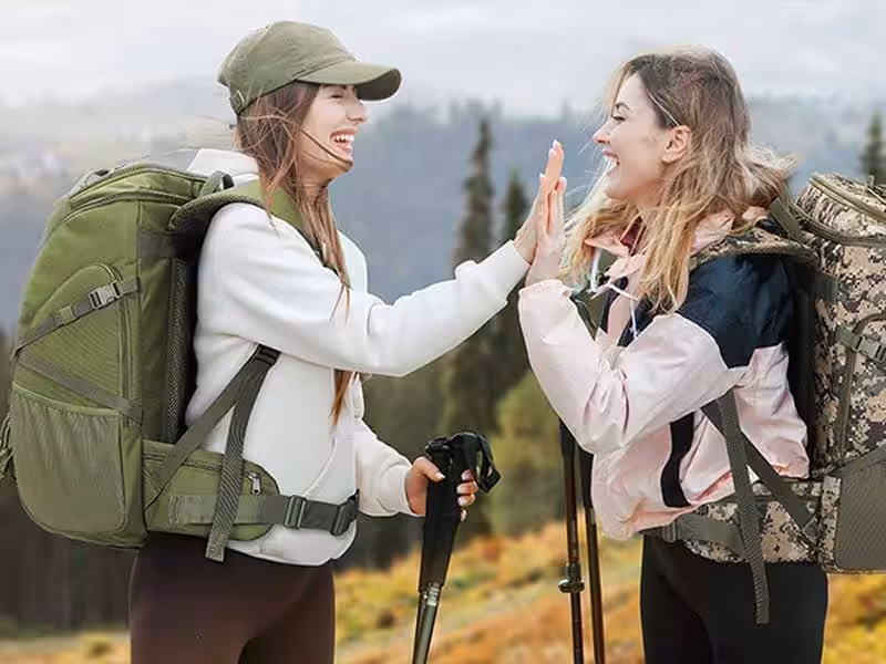 Two girls carrying backpacks