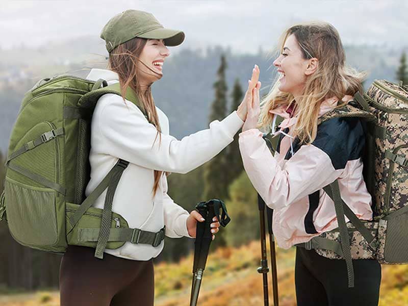 Two girls carrying backpacks
