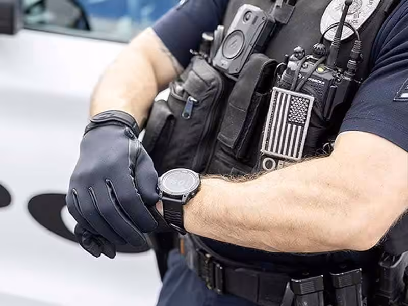 A police officer wearing tactical gloves