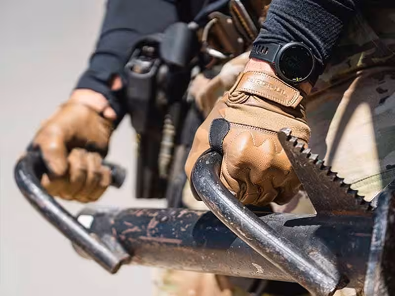 The person who was holding the object was wearing gloves.