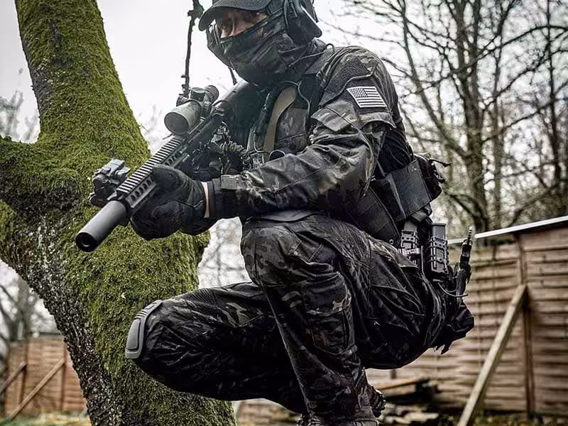 A soldier crouching down.