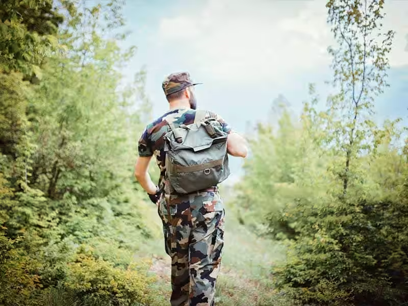 A soldier carrying a backpack