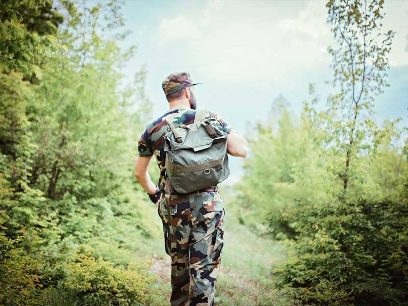 A soldier carrying a backpack