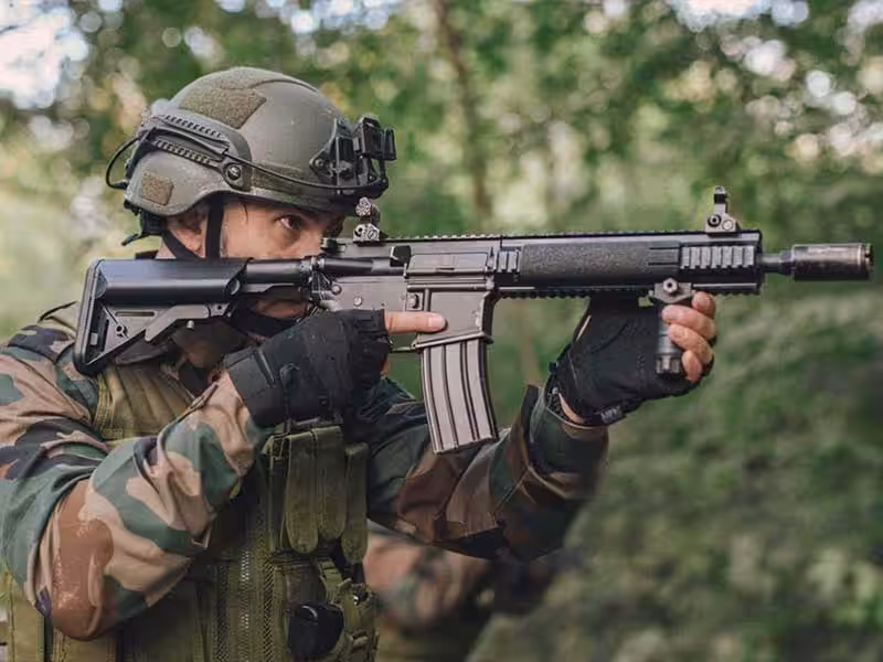 A soldier wearing tactical gloves