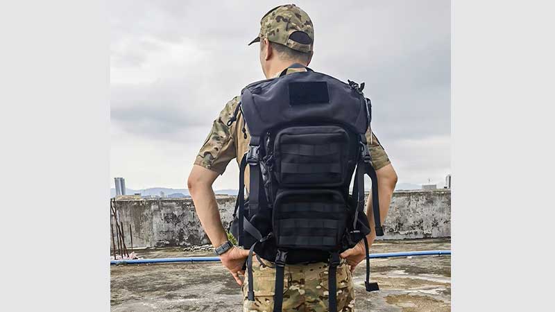 MOLLE tactical backpack with accessory pouches and hydration system