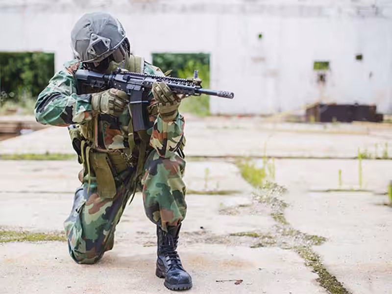 A soldier who is practicing shooting.