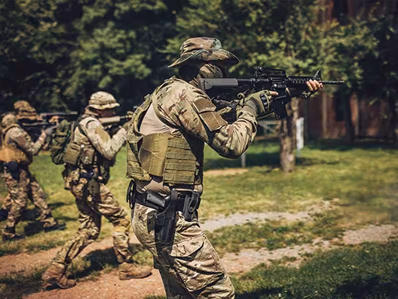 Three soldiers advancing forward