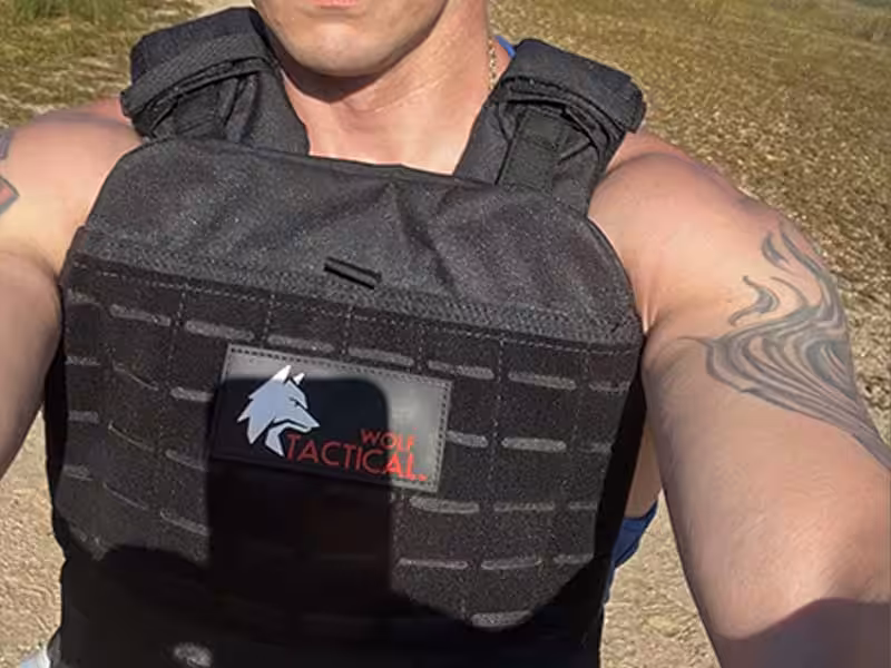 A person carrying a bulletproof vest.