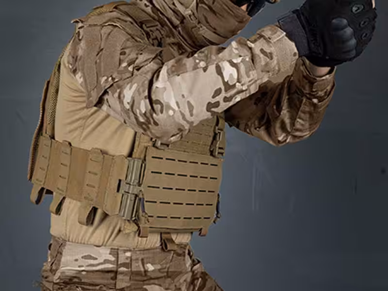 A soldier carrying a bulletproof vest.