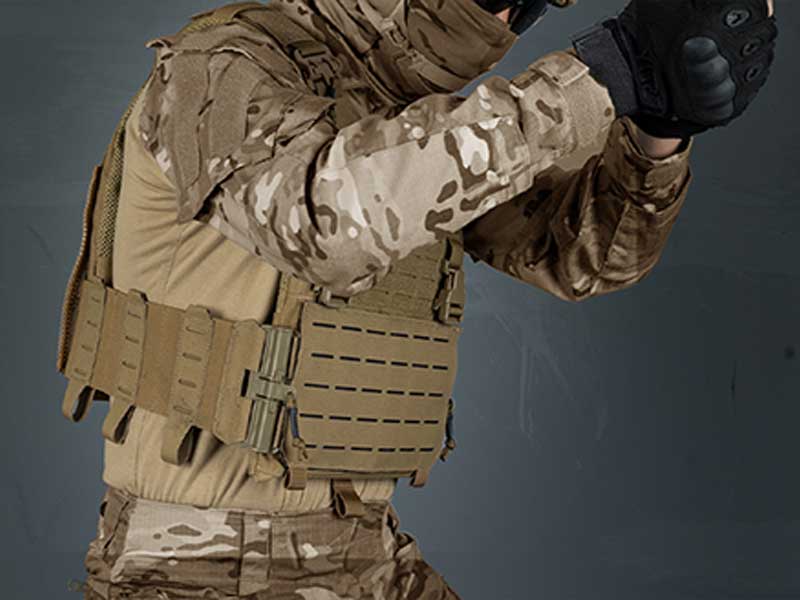 A soldier carrying a bulletproof vest.