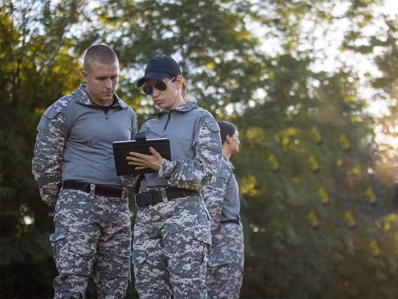 The male and female soldiers were discussing...